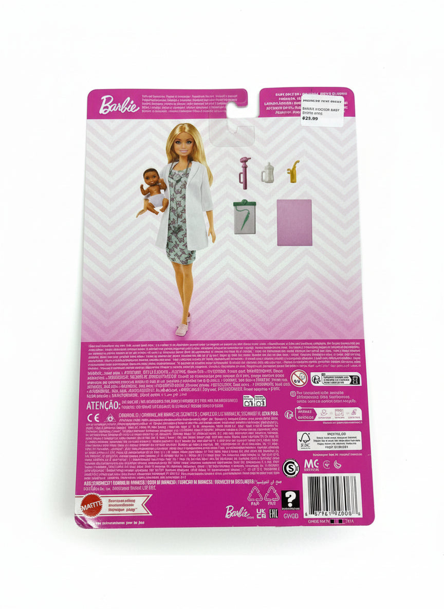 Barbie doll packaging with a baby on a gray background