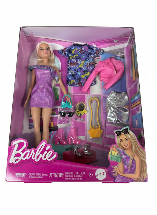 Barbie doll packaging with doll and accessories on a gray background