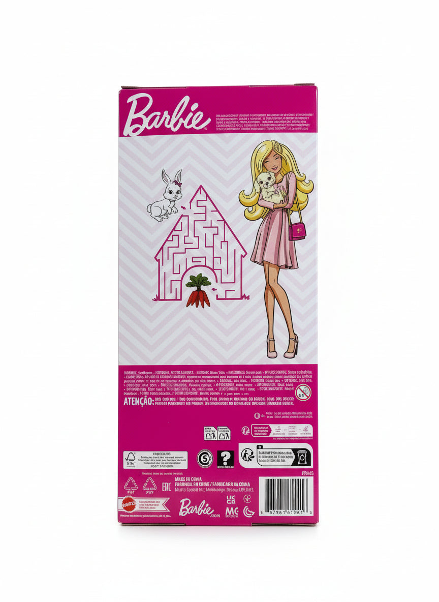 Barbie toy packaging with a maze design on a wooden surface