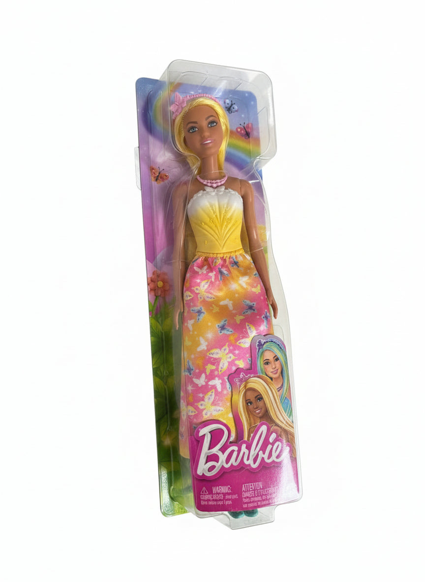 Barbie doll in a colorful dress on a chair with packaging