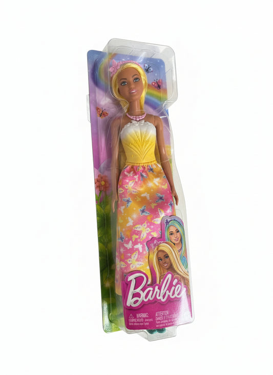 Barbie doll in a colorful dress on a chair with packaging