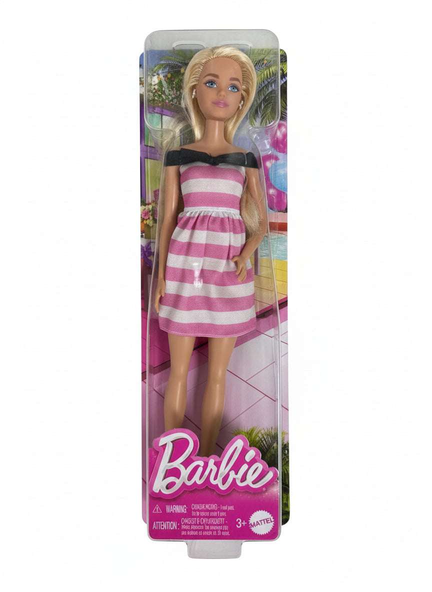 Barbie doll in a pink and white striped dress on a chair
