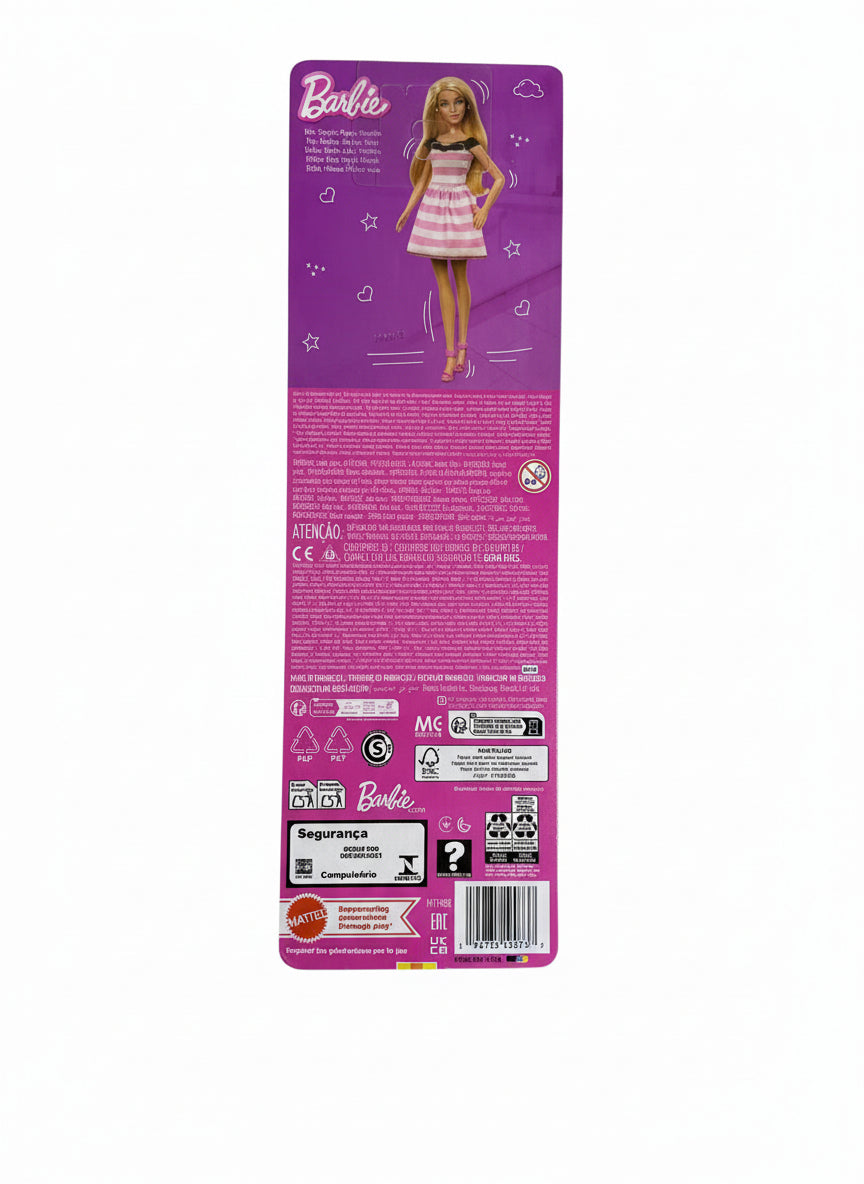 Barbie doll packaging on a chair