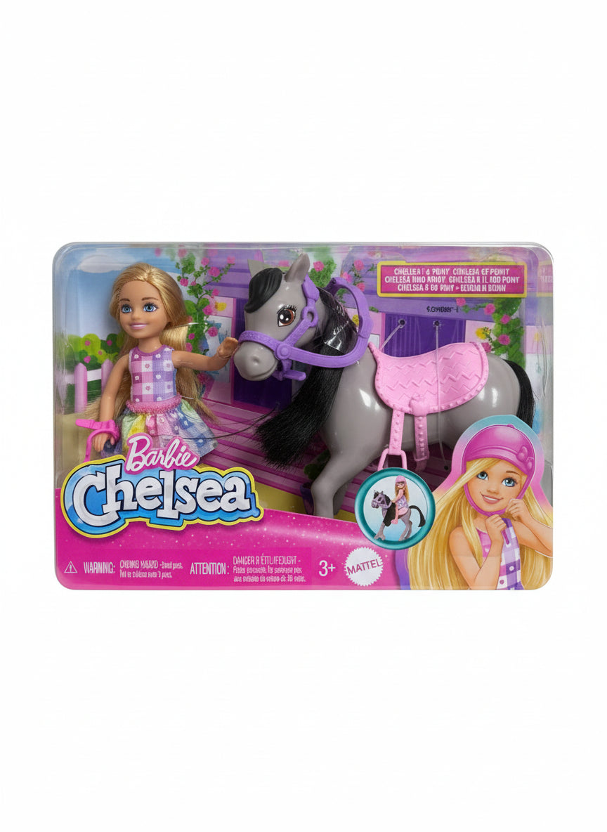 Barbie Chelsea doll and horse set in packaging on a wooden floor