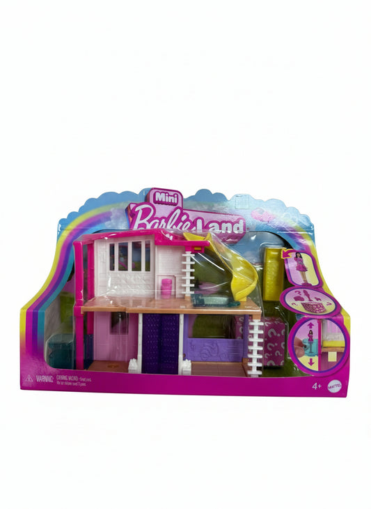 Barbie mini house in packaging on a wooden floor